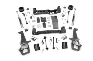 Rough Country Suspension Lift Kit 4 in. Lift Incl. Knuckles Strut Spacer Crossmembers Diff Drop Brkt. Driveshaft Spacer Swaybar Link Skid Plate Coil Spacer Bump Stop Brkt. - 32830